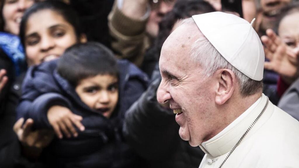 Pope Francis as he emerges from the door of the Jesus church in Rome yesterday. The Pontiff called on the religious orders to be “real witnesses of a world doing and acting differently” in a meeting with 120 leaders of male religious orders last November. Photograph: Angelo Carconi/Epa