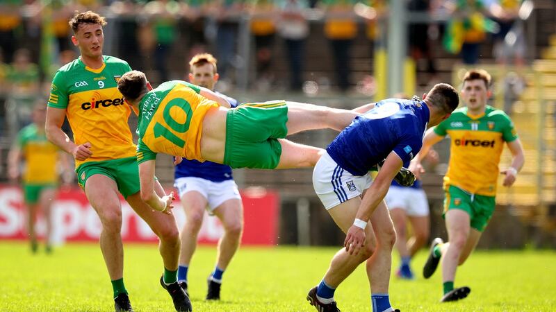 Cavan’s James Smith and Ciaran Thompson of Donegal in action during their Ulster semi-final meeting at Clones. Photograph: Ryan Byrne/Inpho