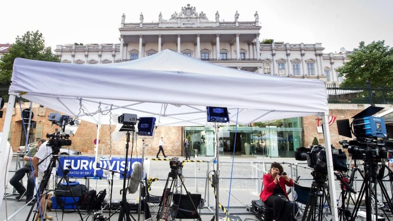 A television journalist fixes her make-up outside the Palais Coburg Hotel in Vienna where Iran nuclear talks are expected to reach a conclusion on Monday. Photograph: Joe Klamar/AFP/Getty Images.