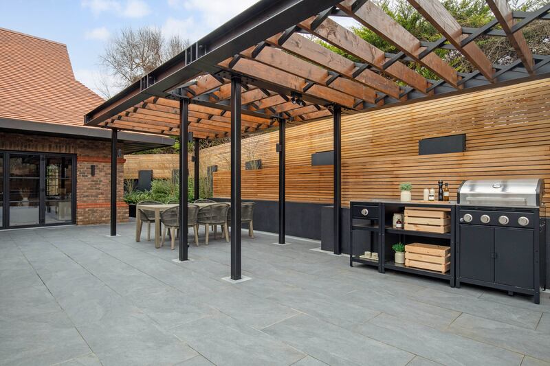 Pergola with outdoor dining and cooking area