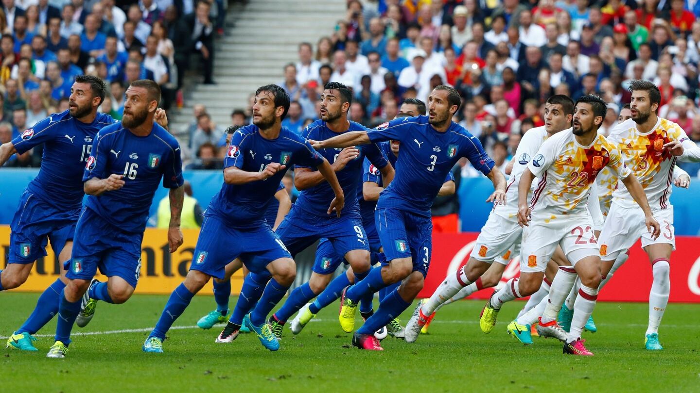 Italy and Spain players in action.  Photo:  Christian Hartmann/Reuters
