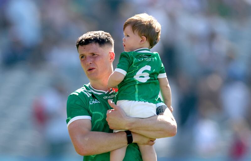 Limerick’s Iain Corbett with his son Dylan after the Tailteann Cup final defeat to Kildare at Croke Park in July. Photograph: James Crombie/Inpho