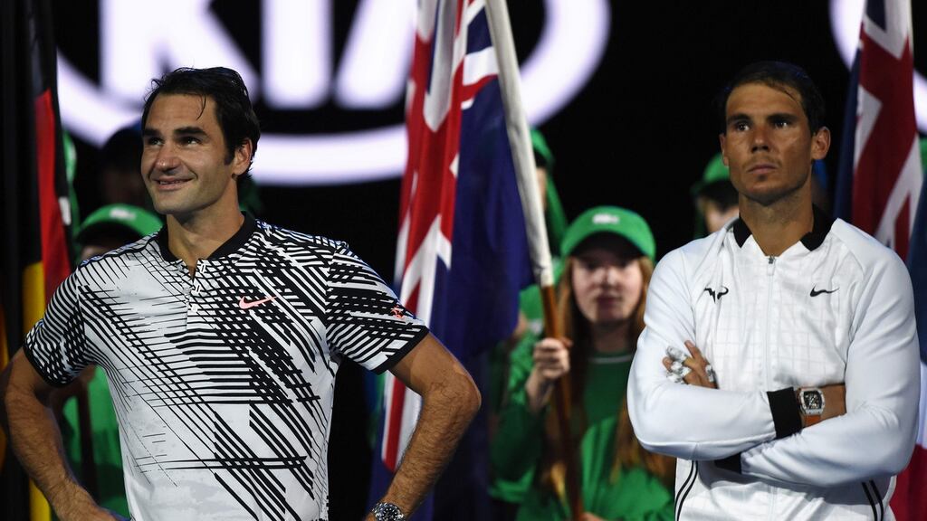 Switzerland’s Roger Federer and Spain’s Rafael Nadal wait for the start of the awards ceremony after their men’s singles final match in Melbourne. Photograph: Getty Images