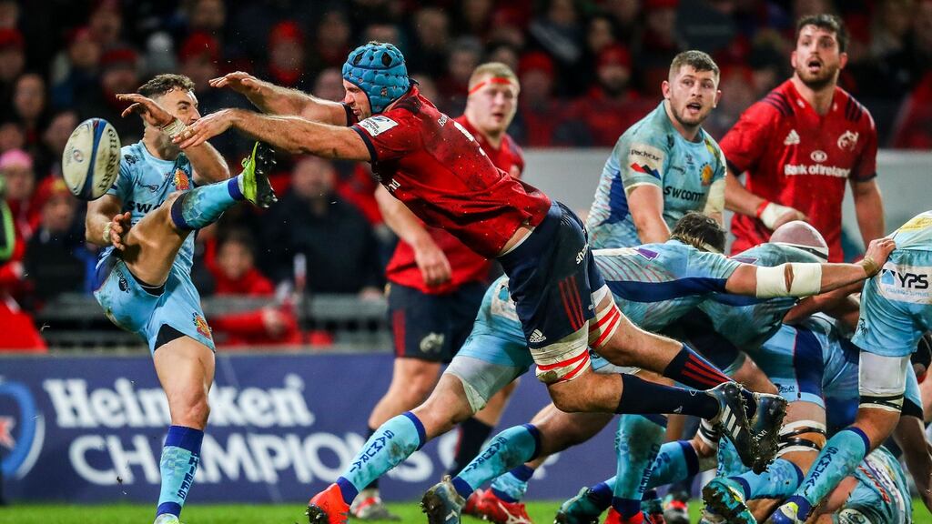 Munster’s Tadhg Beirne blocks a kick from Nic White of Exeter Chiefs during the Heineken Champions Cup Round 6 match at Thomond Park, Limerick on Saturday.  Photograph: Tommy Dickson/Inpho