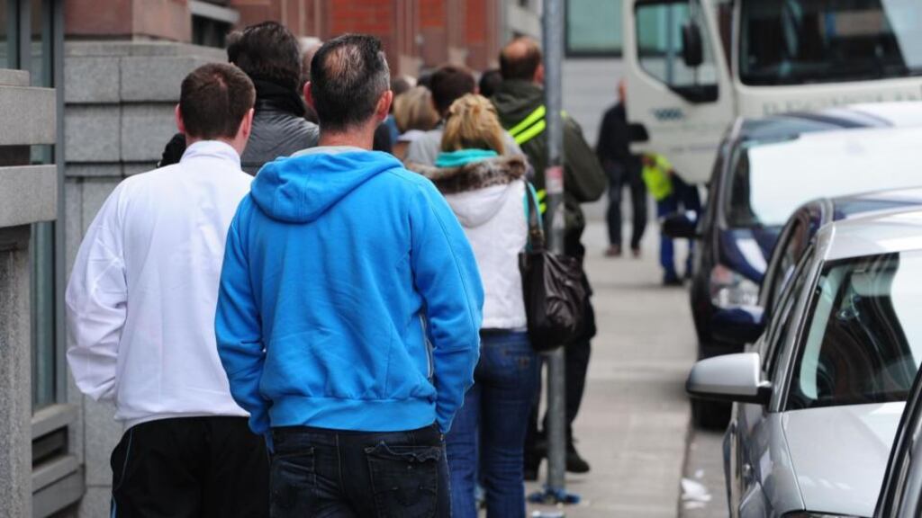 A queue for jobseekers’ payments in Dublin. Irish output remains 4% below the pre-crisis peak, unemployment is high and unit labour-cost inflation remains negative. Photograph: Aidan Crawley