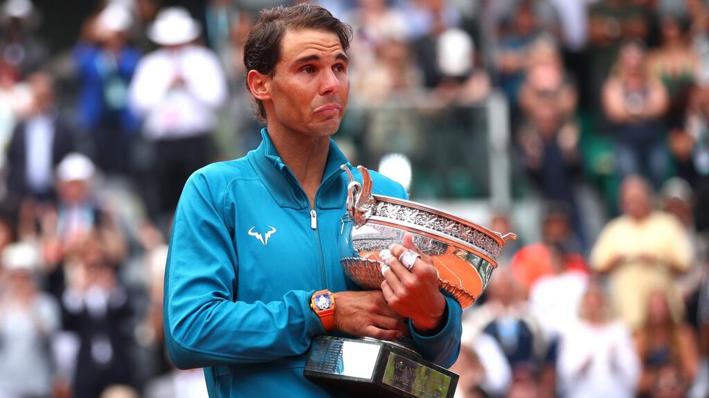 Rafael Nadal shows his emotions as he hugs the Musketeers’ Cup  following the men’s singles final against Dominic Thiem of Austriaon Sunday in Paris. Photograph:  Clive Brunskill/Getty Images