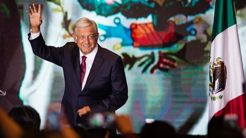 Andrés Manuel López Obrador salutes attendants after the elections for the presidency of Mexico in the Media Center at the Hilton Hotel in Mexico City in July 2018. Photograph: Getty Images