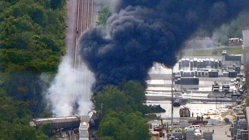 A CSX Corp derailed train car carrying chemicals burns after being struck by a truck in Rosedale, Maryland. Photograph: Kim Hairston/Baltimore Sun/Reuters.