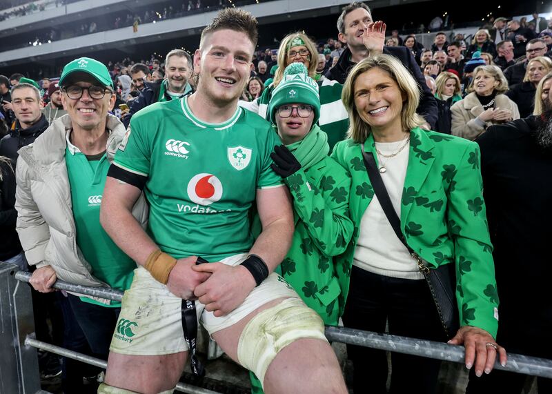 Joe McCarthy gives his Player of the Match medal to his brother Andrew alongside his father Joe and mother Paula. Photograph: Dan Sheridan/Inpho