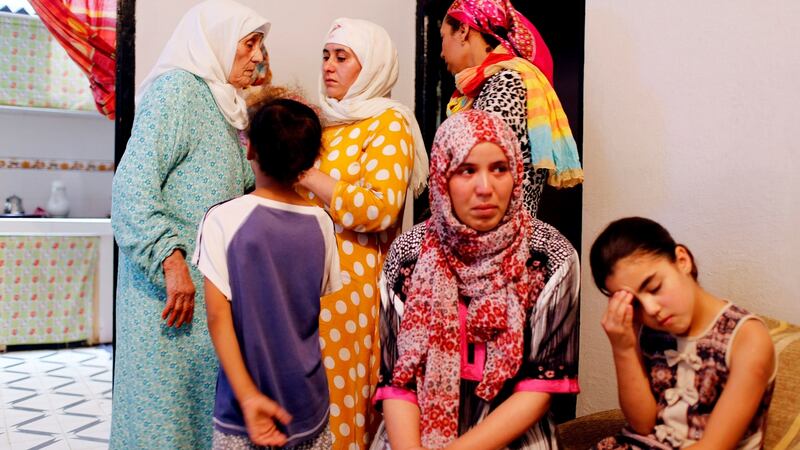Family members of Barcelona attack suspects Younes and El Houssaine Abouyaaqoub, and Mohammed and Omar Hychami are pictured in their family home. Photograph: Reuters/Youssef Boudlal