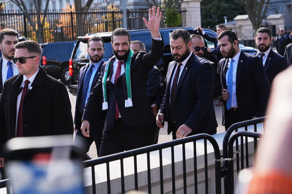 Ahmed al-Sharaa waves as he greets supporters outside the White House. Photograph: Jacquelyn Martin/AP