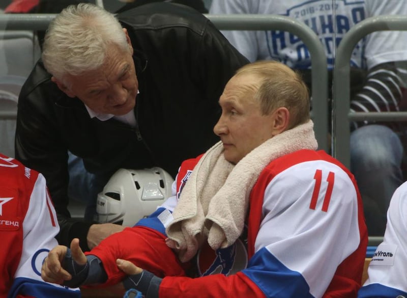 Vladimir Putin listens to Gennady Timchenko during a hockey match at the Black Sea resort of Sochi in May 2017. Photograph: Mikhail Svetlov/Getty Images