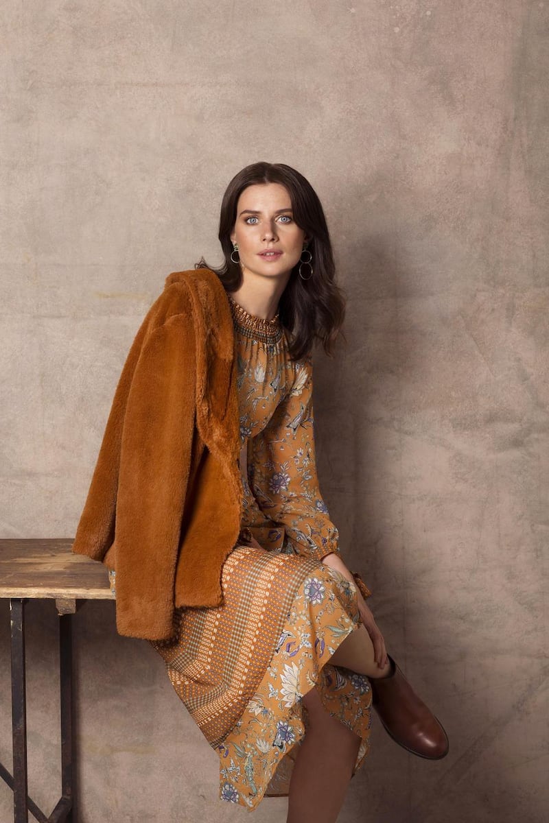 Border print maxi dress €79, fur jacket €59. Photograph: Naomi Gaffey