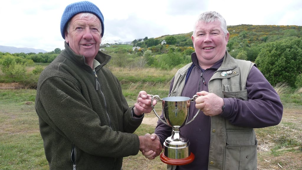 Gary Coughlan, right, being presented with the Lough Conn Trophy by Wicklow Anglers’ president Stuart McGrane