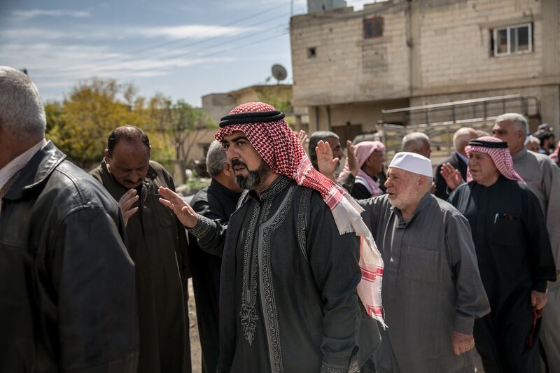 Elders arrive at a memorial for people killed by Israeli attacks in Koya, southern Syria. Photograph: Sally Hayden
