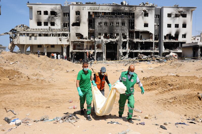 Palestinian forensic and civil defence personnel recover human remains at Al-Shifa hospital, Gaza's largest, which has been badly damaged in Israeli strikes, on April 8th, 2024, as Israel's war against Hamas continues. Photograph: AFP/Getty