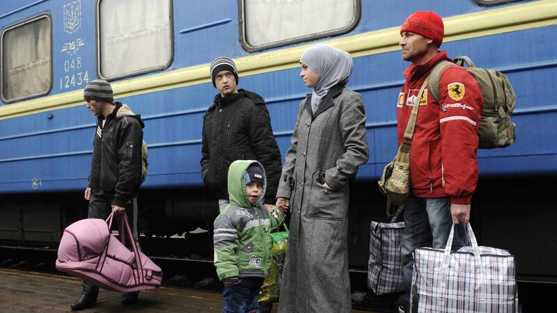 A  family of Crimean Tartars arrive in Lviv. Photograph: Yuri Lashov/ AFP/ Getty