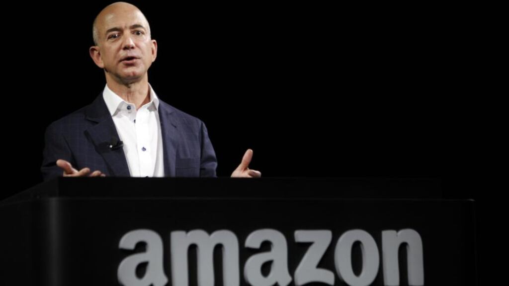 Jeff Bezos, chief executive officer of Amazon.com. The world’s largest online retailer today unveiled Amazon Local Register, a free smartphone and tablet application and $10 card reader that plugs into a handheld device. Photo: Bloomberg