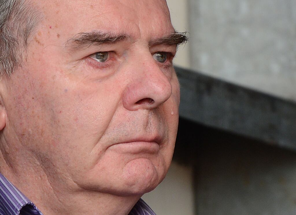 Tears roll down the face of Sean Quinn as his daughter speaks on behalf of the family at a 2012 rally to show support for the family. Photograph: Alan Betson/The Irish Times
