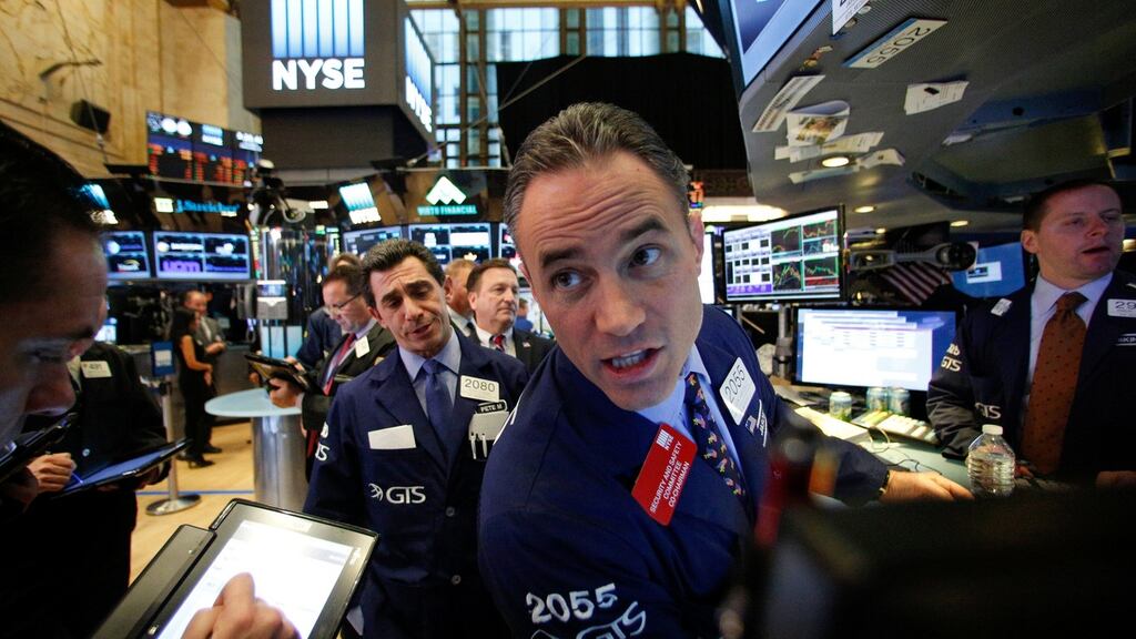 Traders work on the floor of the New York Stock Exchange . Photograph: Brendan McDermid/Reuters