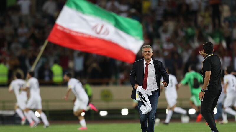 Head coach Carlos Quieroz and players celebrate after Iran’s win over  Uzbekistan  in Tehran. Photograph: Amin M Jamali/Getty Images