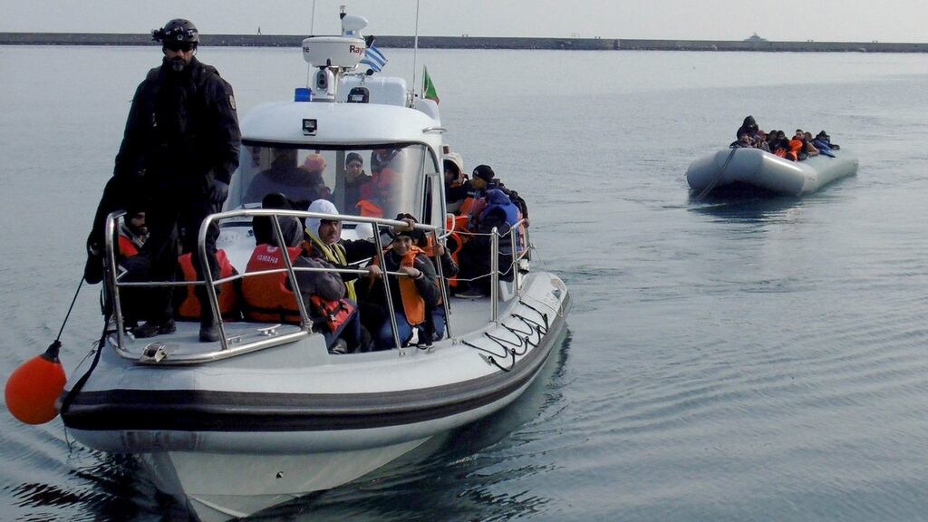 FIle image: A group of refugees and migrants are towed in a dinghy by a coast guard patrol boat, following a successful rescue operation, on the Greek island of Lesbos. Photograph: EPA.