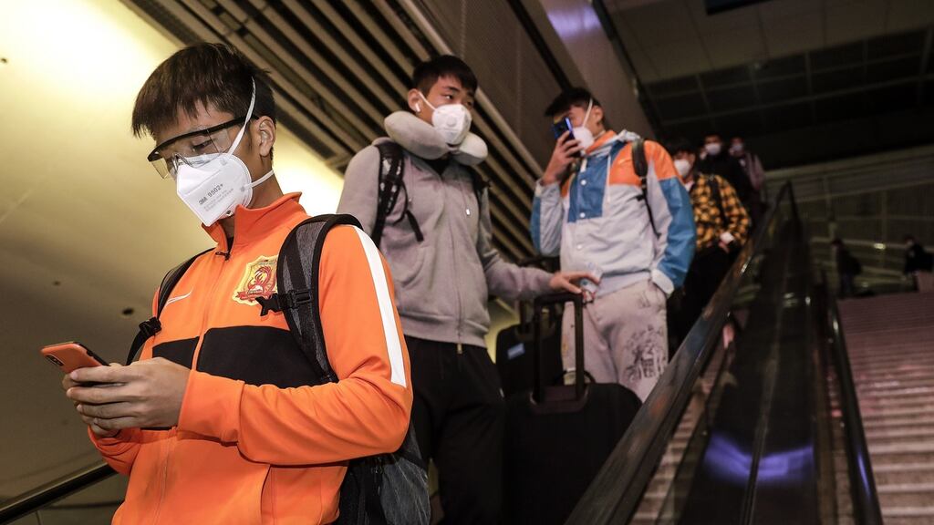 Wuhan Zall players arrive at Wuhan railway station last week after being stranded for 104 days. Photo: Getty Images