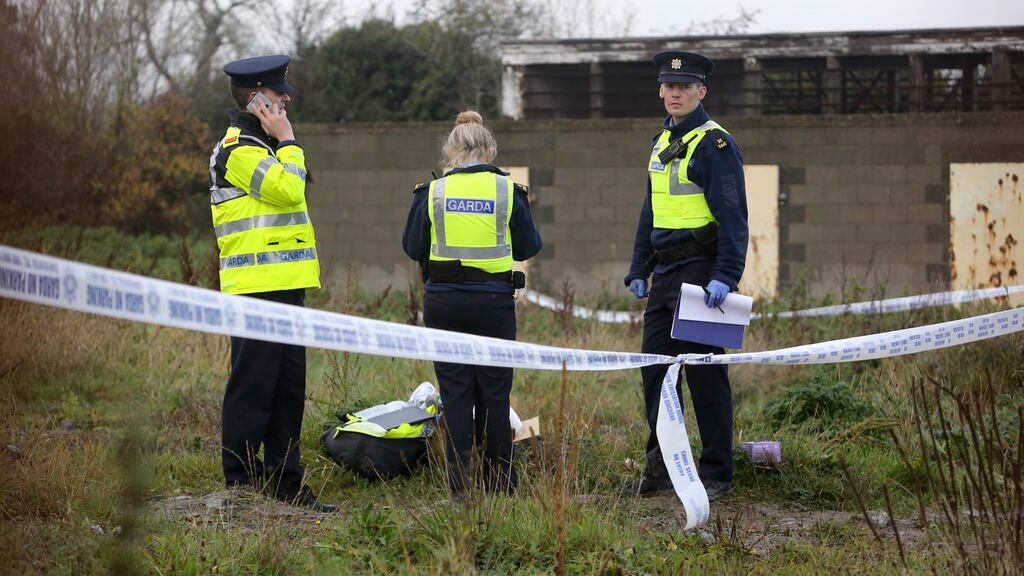 Gardaí pictured at the scene where  a body was found in the Balbutcher Lane area of Ballymun on Monday.  Photograph: Collins