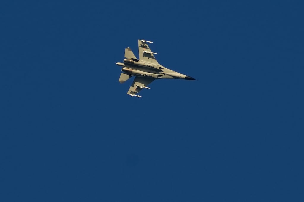 A military fighter jet flies above the Taiwan Strait as seen from the 68-nautical-mile scenic spot, the closest point in mainland China to the island of Taiwan. Photograph: Ng Han Guan/AP