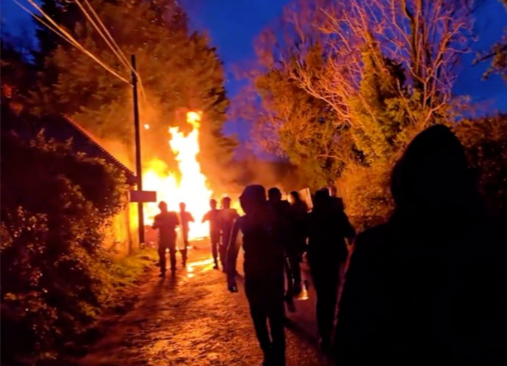 A screengrab from a social media posting shows gardaí and protesters near a site in Newtownmountkennedy, Co Wicklow earmarked for asylum seekers.. Photograph: X/Twitter