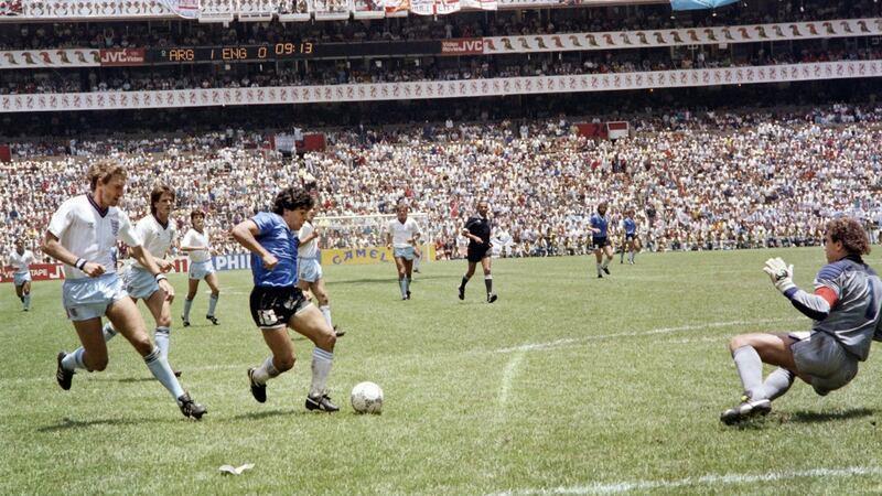 Diego Maradona scores against England during the 1986 World Cup in Mexico. Photograph: AFP via Getty Images