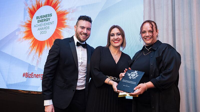 Katherine Valery, awards judge, presents the best energy achievement in tourism and entertainment award to Giada Venturini and Darren Newman, Wren Urban Nest
