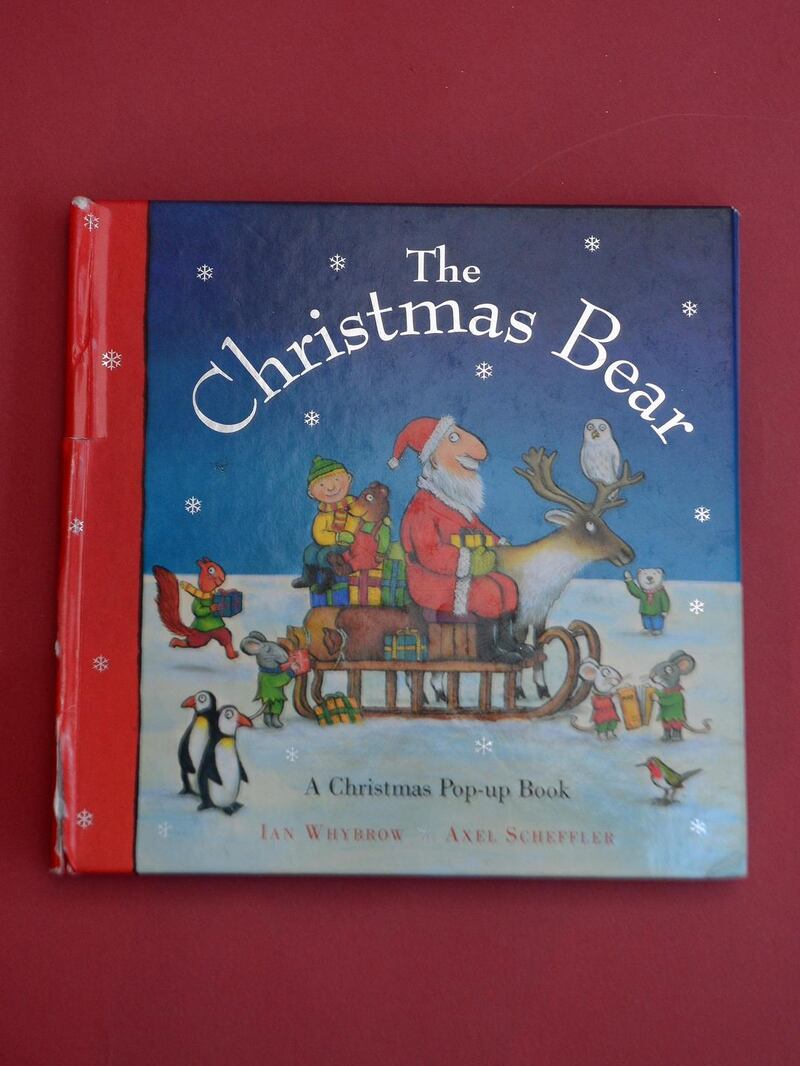 Neasa literally wore out The Christmas Bear, a pop-up book with pull-out tabs and hidden surprises. Photograph: Louise Ní Chríodáin