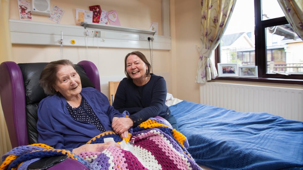 Bridget Cassidy (94) receives a visit from her daughter Angela, who is fully vaccinated and travelled from Wexford to the Plunkett Home in  Boyle,  Co Roscommon. Photograph:  Brian Farrell/The Irish Times