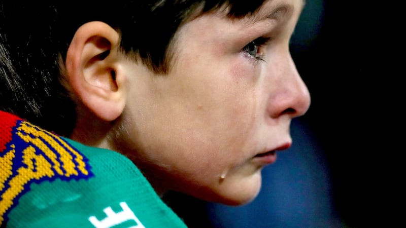 A tearful young Irish fan late in the game. Photograph: James Crombie/Inpho
