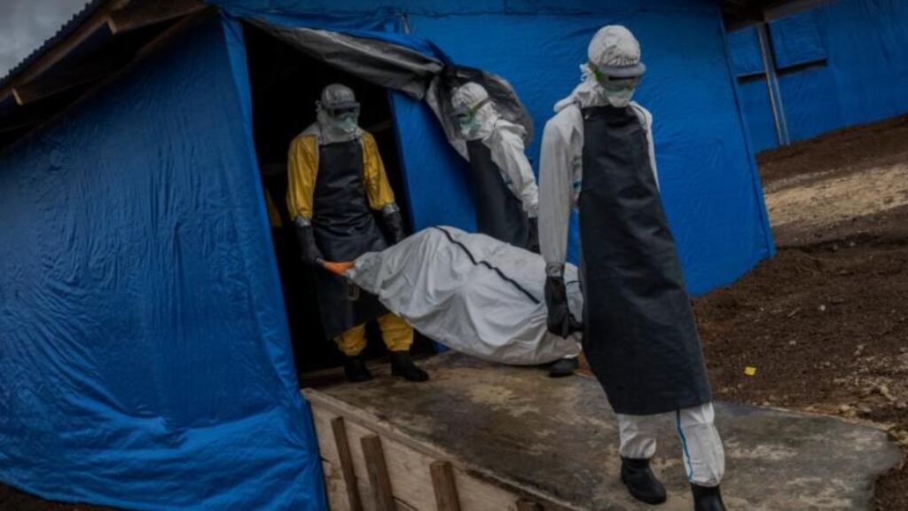A burial team takes a body from an Ebola clinic in rural Bong County, near Gbarnga, Liberia, earlier this month. Photograph: Daniel Berehulak/The New York Times