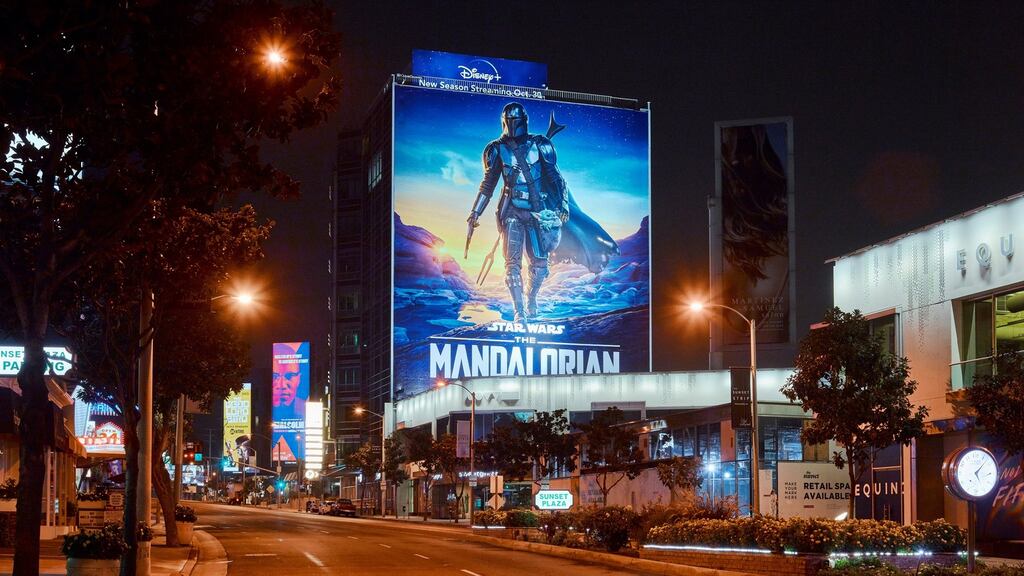 A billboard advertising The Mandalorian, from Disney+, on Sunset Boulevard in West Hollywood, California.