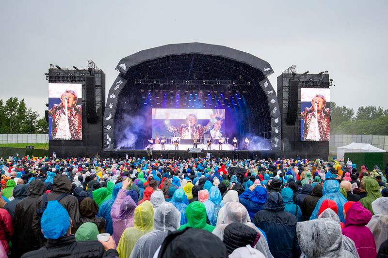 Fans, almost all ready with their rain gear, at the Rod Stewart concert at the Royal Hospital Kilmainham, Dublin, on Sunday evening. Photograph: Tom Honan/The Irish Times