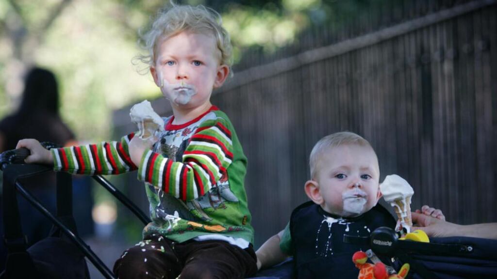 Young boys savour their ice cream cones on a summer’s day in Herbert Park, Dublin. Temperatures are expected to reach 25 degrees in parts next week. Photograph: Bryan O’Brien/The Irish Times
