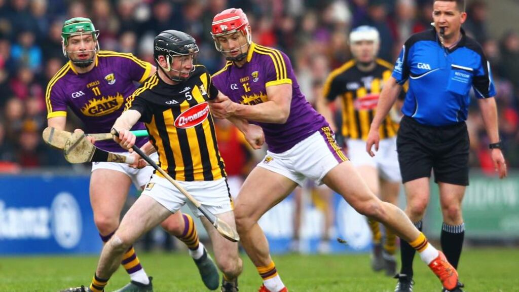 Conor Delaney holds off Lee Chin during Kilkenny’s win over Wexford. Photograph: Ken Sutton/Inpho