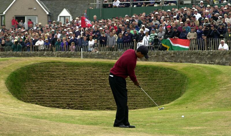 Tiger Woods putts around the 17th hole greenside bunker, during his final round of the Open Championship on his way to victory at St. Andrews in 2000. Photograph: Rebecca Naden/PA
