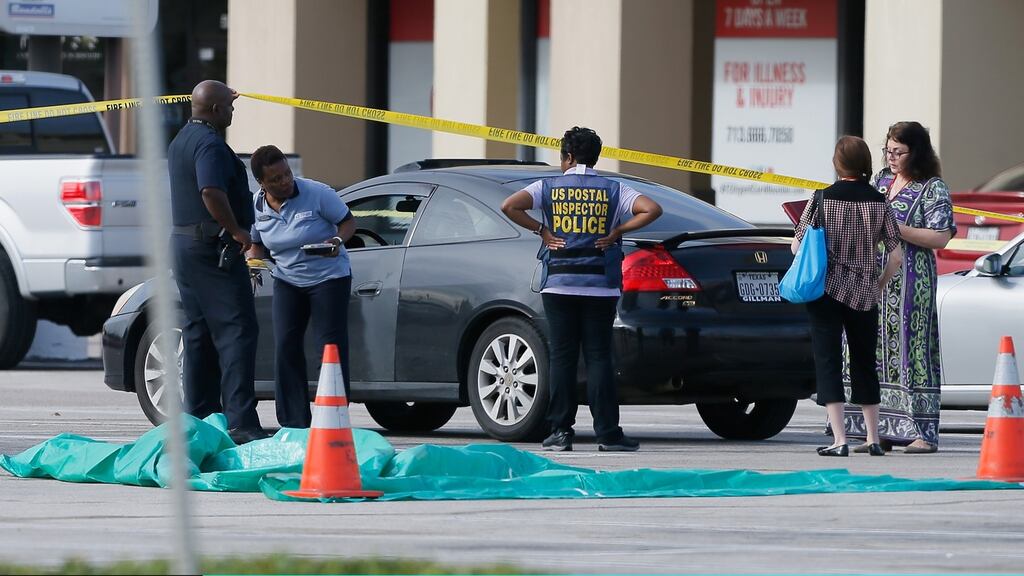 US investigators looks over the scene where nine people were shot in Houston, Texas. File photograph: Bob Levey/Getty Images