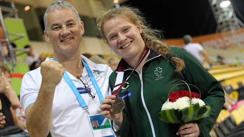 Ireland’s Noelle Lenihan celebrates her silver medal with coach Dave Sweeney at the World Paralympics Games in Doha, Qatar. Photograph: Marcus Hartmann/Sportsfile