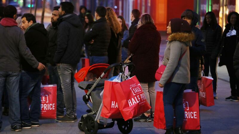 Shoppers queue on Henry Street in Dublin this morning ahead of the shops opening and the beginning of the St Stephen’s Day sales. Photograph: Collins