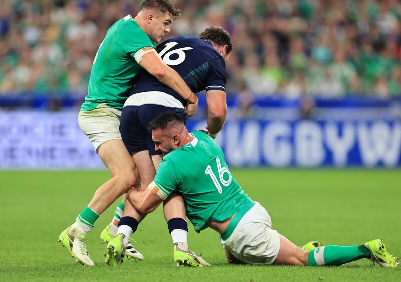 Scotland’s Ewan Ashman is tackled by Ireland’s Garry Ringrose and Ronan Kelleher. Photograph: Billy Stickland/Inpho