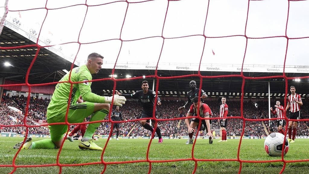Dean Henderson of Sheffield United is beaten by a shot from Georginio Wijnaldum which was enough to give Liverpool victory at Bramall Lane. Photograph: Laurence Griffiths/Getty Images