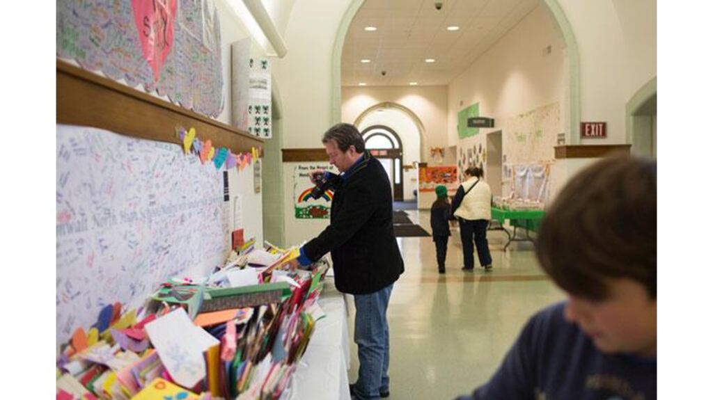 Ross MacDonald works on digitising the thousands of letters written in the aftermath of the Sandy Hook school shootings. Photograph: Christopher Capozziello/The New York Times
