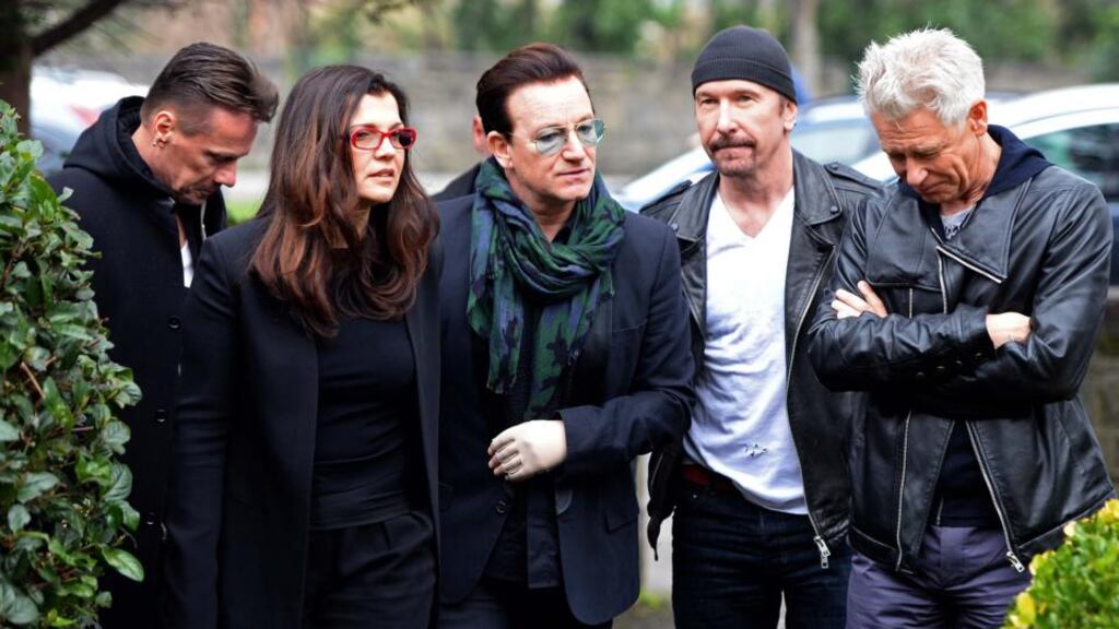 Bono with his wife Ali and U2 band members Larry Mullen , Adam Clayton and The Edge, at the funeral of radio DJ Tony Fenton, at Donnybrook, Dublin. Photograph: Eric Luke