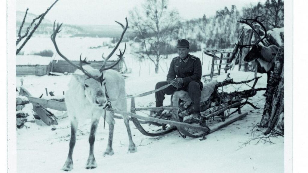 A German soldier sitting on a sledge in occupied Norway, in 1940 or 1941, the imagined setting of The Moon is Down. Photograph: Imagno/Getty Images