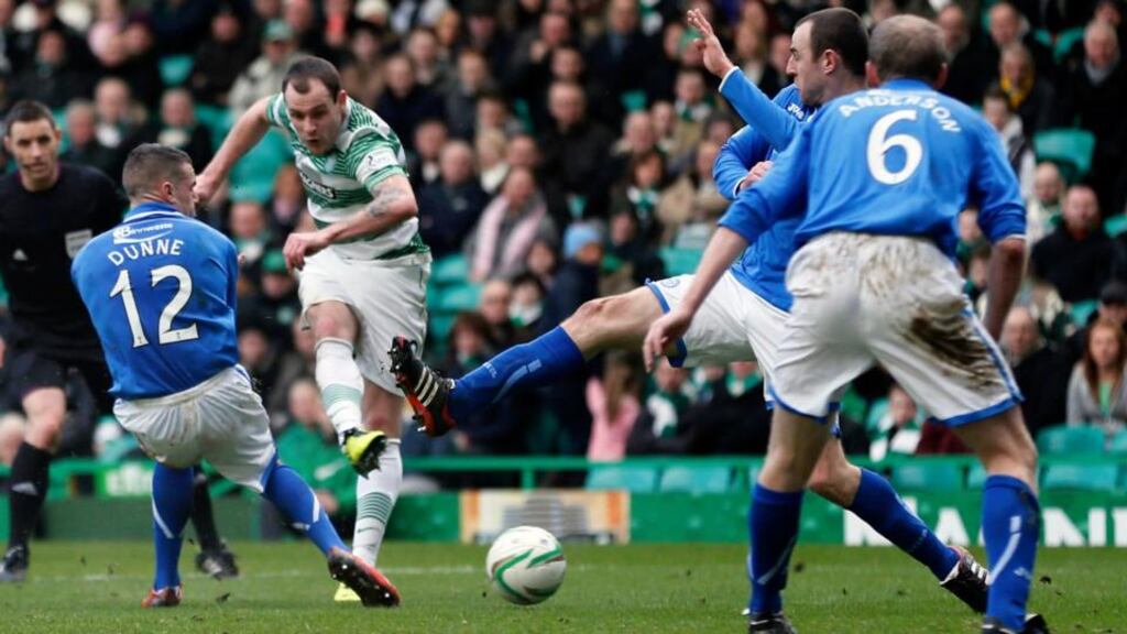 Celtic’s Anthony Stokes (second left) scores his third against St Johnstone at Celtic Park. Photograph: Russell Cheyne/Reuters